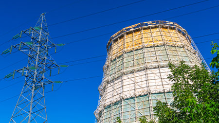 Large cooling towers of thermal power plants. A cooling tower for cooling water and a power line...