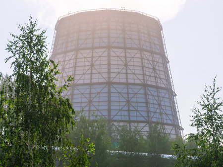 A huge cooling tower of a thermal power plant. Large production pipeline. Cooling tower for cooling...