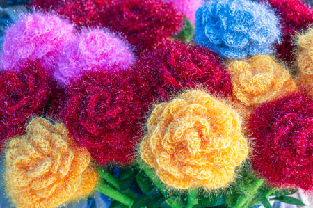 Background of multicolored flowers. Wool products. handmade decoration.の写真素材
