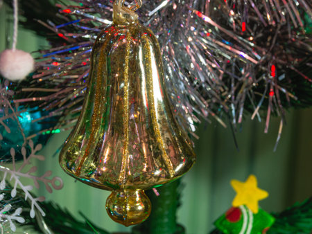 A Christmas toy on a Christmas tree. Christmas toys on the green branches of the Christmas tree. Decorations and a burning garland on the Christmas tree.の写真素材