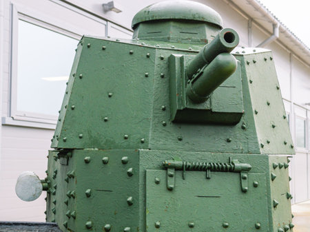 The tower of an old tank with a gun. old armored vehicles. Tracked tank with riveted hull and turret. A rare instance of a tank.の写真素材