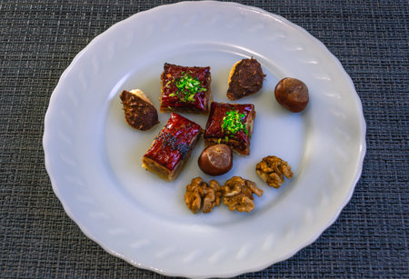 Natural sweet baklava with honey and nuts. Oriental sweets with nuts. natural products on a plate....