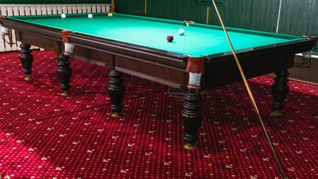 Billiard table with greencloth. billiard room. board game. Billiard club for relaxing in your free time. White balls on a green billiard table with pockets.の写真素材