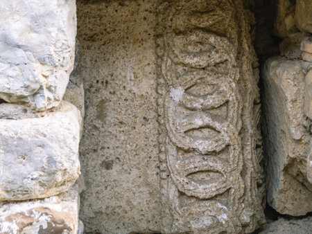 Background of the masonry of an ancient temple. Place of religious ceremonies. An ancient stone wall...