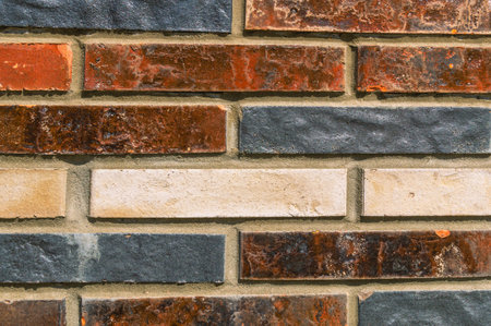 Facade tile for brick. Decorative artificial stone for brick. Cladding of exterior walls during the...