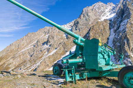 Cannon in the mountains against avalanches. Avalanche cannon. Anti-aircraft gun for shooting on the slopes of the mountains to make the snow come off.の写真素材