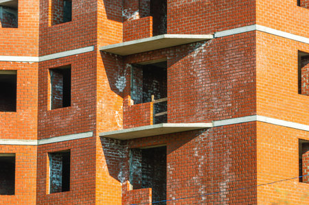 Efflorescence in violation of the masonry mixture formulation. Salt on the brickwork.There are efflorescences on the facing brick.Unfinished brick building.White plaque on the brick walls of buildingsの写真素材