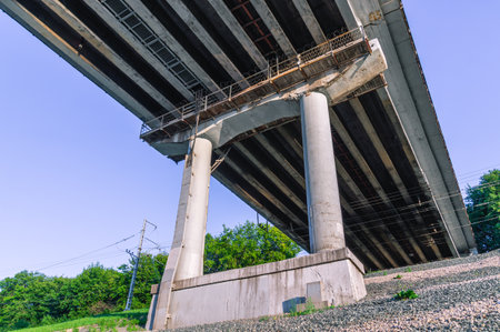 Concrete pillars of a transport bridge across the river. Concrete for the construction of bridges. A...