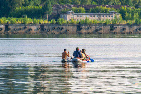 Active recreation on an inflatable boat on a large river. Inflatable boat tourism. outdoor water...