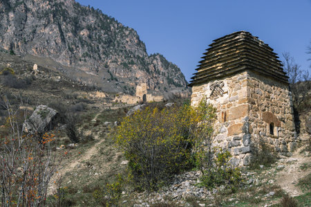 An ancient stone structure for burials in an ancient city. A crypt made of stones high in the mountains. A stone ritual structure for deceased people.の写真素材