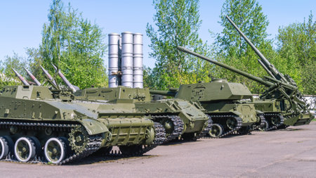 Heavy long-range armament of the army. Armored artillery howitzer installations on a tracked track....