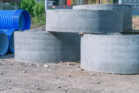 Reinforced concrete through rings for wells. Reinforced concrete products that are used in the construction of wells, sewerage, drainage, water supply and other communications. Construction technologiesの写真素材