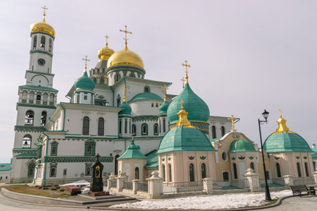 Medieval old white stone church with golden domes. The Resurrection New Jerusalem Monastery in...