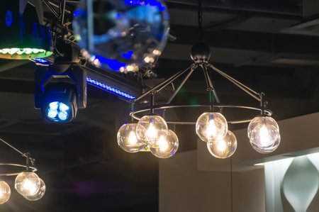 Illumination and illumination in the room. Lights and festive mood. A light in a dark bar. Lamps and...