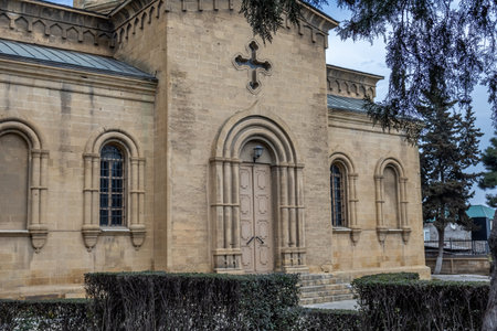 The Armenian Orthodox Church in Derbent. The walls of the ancient church are made of hewn shell stone. The church building is cross-domed. Religion and culture of people in the past centuries.の写真素材