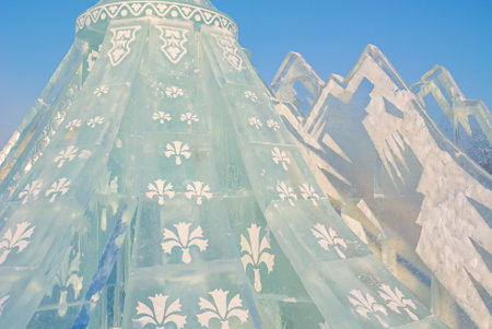A figure made of ice with patterns in a winter park. Sculptures made of ice blocks with lighting....