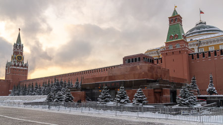 The Kremlin Wall in winter in Moscow. The mausoleum near the Kremlin on Red Square. Snow-covered fir...