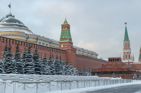 The Kremlin Wall in winter in Moscow. Red Square with a cobblestone pavement. Winter in Moscow on the eve of the New Year. Frosty weather in Moscow during the Christmas holidays.の写真素材