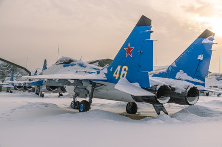 A Soviet multipurpose supersonic fighter. A blue fighter jet in winter at the airfield. The supersonic aircraft is designed to engage and destroy air targets and ground targets.の写真素材