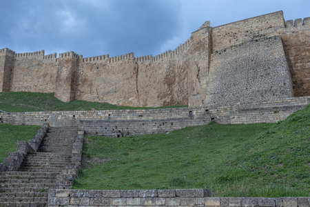 The walls of the ancient fortress are made of large stone blocks. View of the ancient Persian citadel. Ancient defensive structures. The high walls of the fortress in the Caucasus.の写真素材