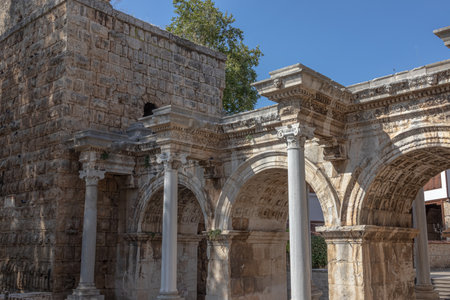 The Arch of ancient times. The famous gate, built in honor of the ancient Roman emperor. The Arc de Triomphe in the Kaleici area. Hadrian's Gate in Antalya. The arch is decorated with carved patterns.の写真素材