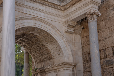 The Arch of ancient times. The famous gate, built in honor of the ancient Roman emperor. The Arc de Triomphe in the Kaleici area. Hadrian's Gate in Antalya. The arch is decorated with carved patterns.の写真素材