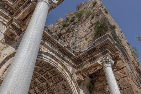 The Arch of ancient times. The famous gate, built in honor of the ancient Roman emperor. The Arc de Triomphe in the Kaleici area. Hadrian's Gate in Antalya. The arch is decorated with carved patterns.の写真素材