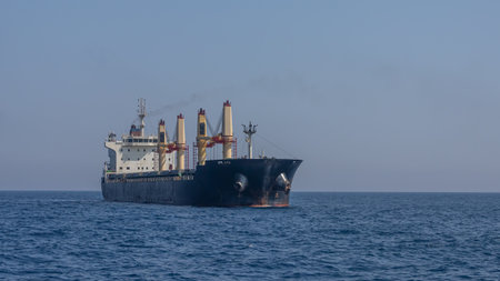 A large marine vessel transports cargo on the high seas. Navigation of large ships. A large cargo...