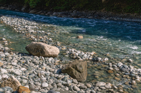 A mountain river with clear and transparent water. Landscape with a view of the cliffs in a mountain...