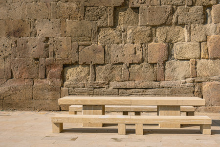 The benches and table are made of sandstone stone blocks. Benches and a table for relaxing against...