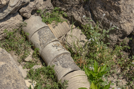 An ancient pipeline on the ruins of an ancient city. Water supply in the ancient city. An ancient device for water supply and sewerage. Ruins in the ancient city of Perge.の写真素材
