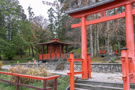 Japanese garden with wooden buildings. Japanese-style landscape design. A park with exotic trees. An oriental-style park area.の写真素材