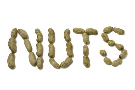Peanuts arranged to spell の写真素材