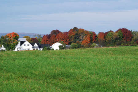 Fall colours around a farm houseの写真素材