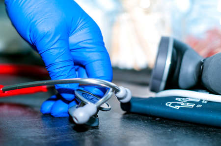 Red Stethoscope with handの写真素材