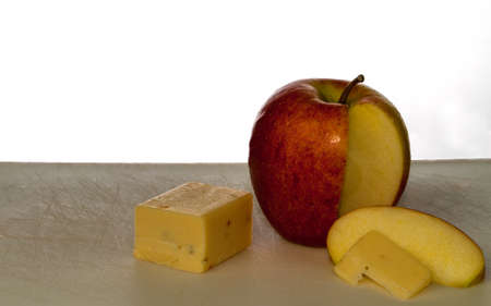 Apple and Cheese with Slices on a cutting boardの写真素材