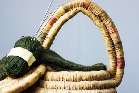 Green socks on a Knitting basket with Socksの写真素材