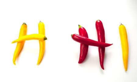 Red and Yellow Hot Peppers in the shape of a Hの写真素材