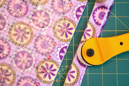 Patterened quilt material with Cutter, cutting board  and ruler