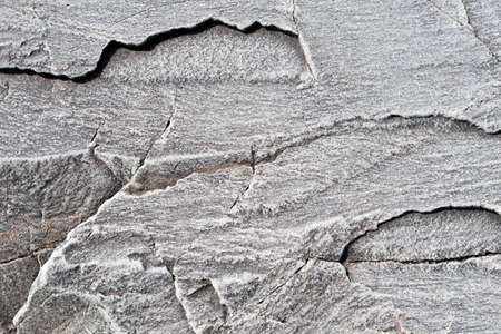 Rock background with cracks and ruged