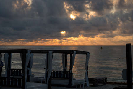 Dawn at the Resort Beach with Beach Cabanas on the Caribbian coastの写真素材