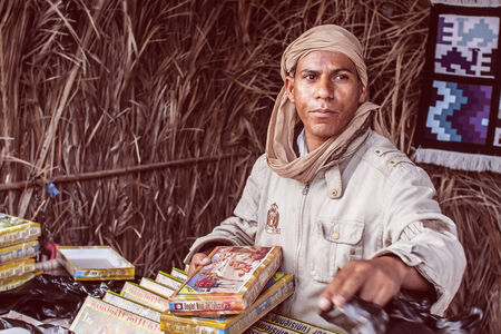 Tunisia - June 25, 2009: Market trader of sweets in North Africaのeditorial素材