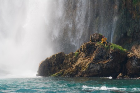 Waterfall Duden,Turkey - Augest,8 2008: Fishing from the rock near waterfallのeditorial素材