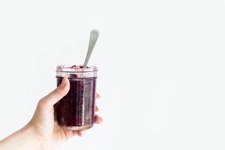 Healthy breakfast. Raspberry smoothie in glass jar on white background