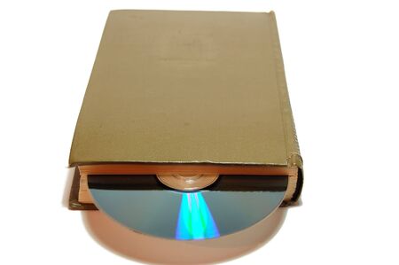 old book with CD isolated on white background with clipping pathの写真素材