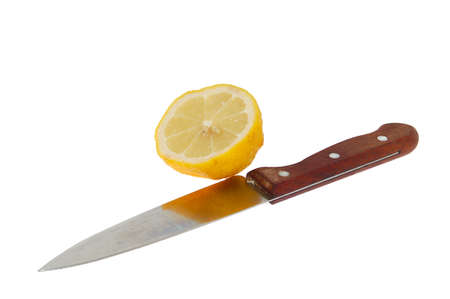 The half of lemon with knifeの写真素材