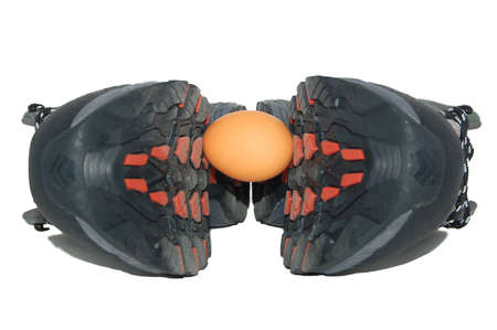 Two men boots cracking eggの写真素材
