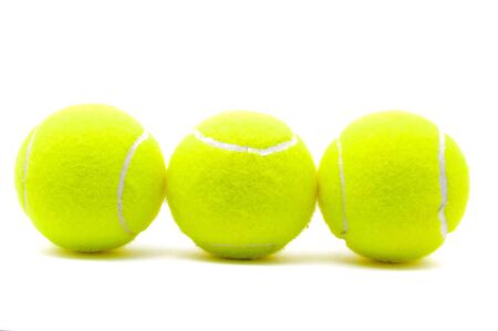 Three tennis balls isolated on the white backgroundの写真素材