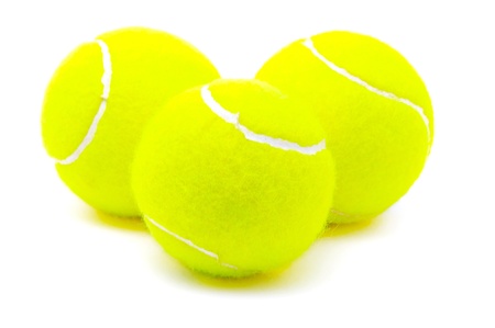 Three tennis balls isolated on the white backgroundの写真素材