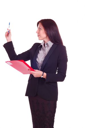 Young attractive business woman holding a folder and pointing to something by penの写真素材